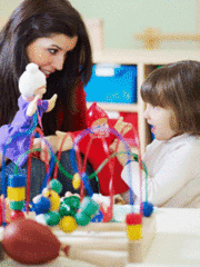 A teacher talking to a young student